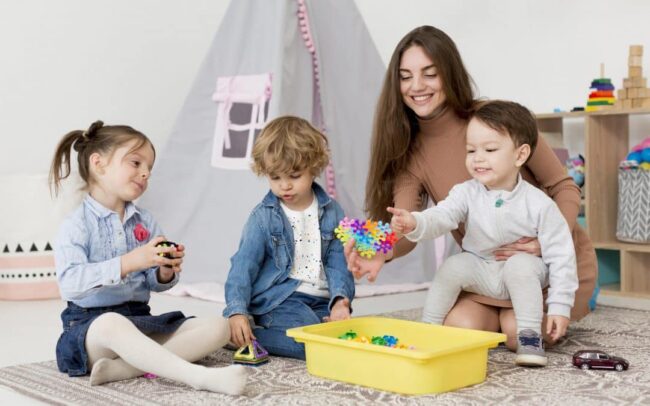 woman-playing-with-children-toys-home-1080×675 homeschool toddlers playing