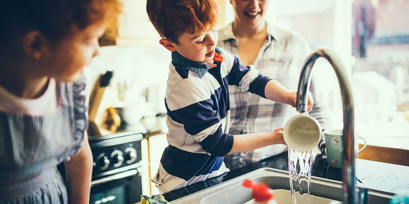 Having Fun Washing the Dishes kids doing chores