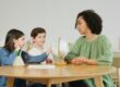 woman-and-kids-sitting-at-a-table