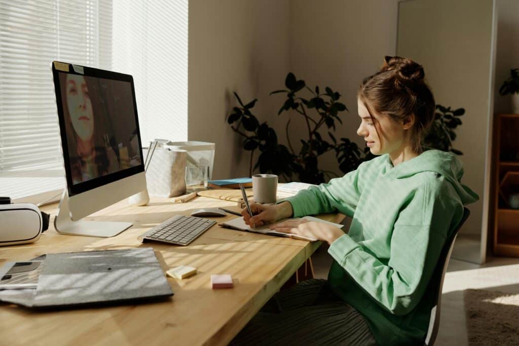 teen sitting a desk