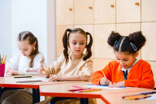 children studying inside a classroom Children Studying Inside a Classroom