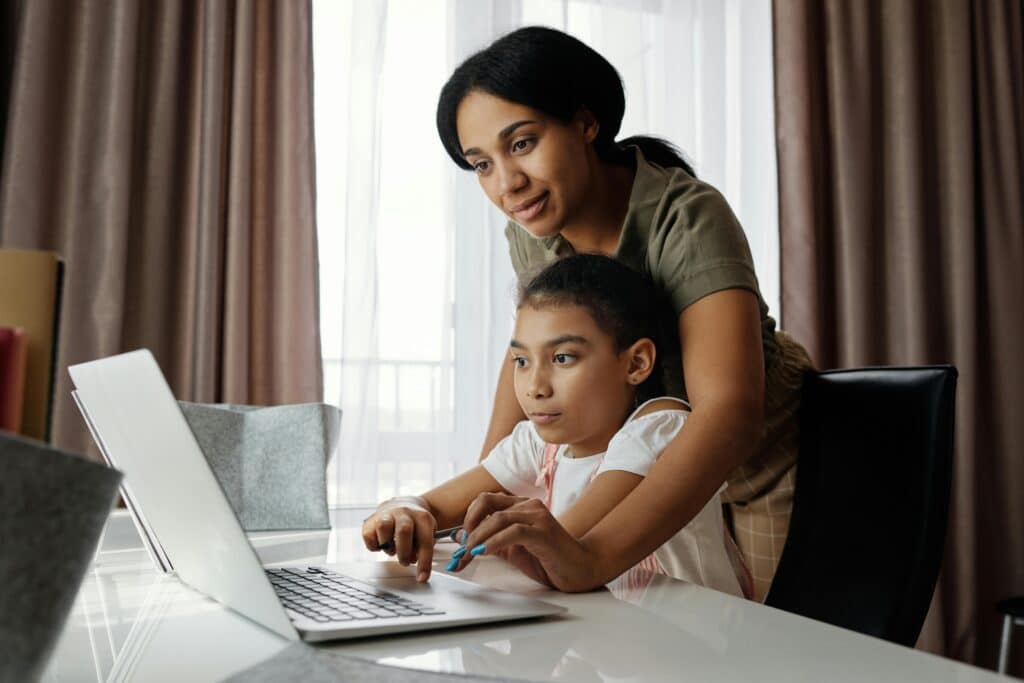 parent watching kid study