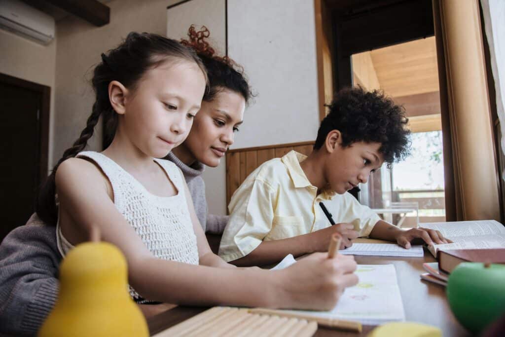 parent with multiple kids studying