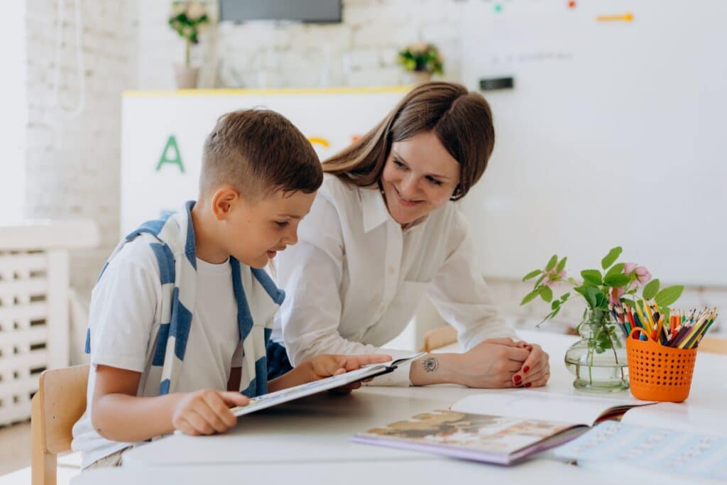 Adult helping kid with images and colours