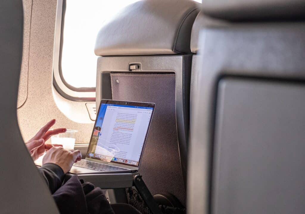 working on a laptop during flight