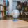 A globe surrounded by shelves filled with books